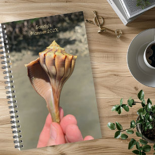 Fotografie van Whelk-schelp op op maat gemaakte pl Planner