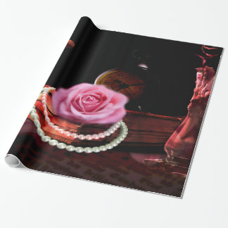 fotomix van roos, boek en zandklok cadeaupapier
