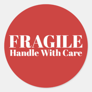 Fragile handgreep met zorg ronde sticker