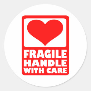 Fragile handgreep met zorg ronde sticker