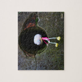 Fubby poppetje dat in een muur zit. Een schattig m Legpuzzel