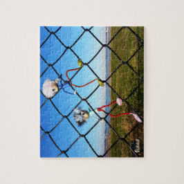 Fubby's die een hek beklimmen. legpuzzel