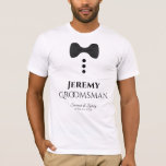 Fun Groomsman Black Cravate Mariage T-shirt<br><div class="desc">Ces t-shirts amusants sont conçus comme des faveurs ou des cadeaux pour les groomsmen mariages. Le t-shirt est blanc et présente l'image d'une cravate d'arc noir et trois boutons. Le texte dit Groomsman, et a un endroit pour entrer le nom du marié ainsi que le nom du couple mariage et...</div>