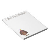 Funny brown farmyard turkey met vliegende cartoon notitieblok (Schuin)