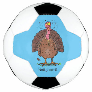 Funny brown farmyard turkey met vliegende cartoon voetbal