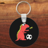 Funny Cartoon Dinosaur die Soccer Black speelt Sleutelhanger (Voorkant)