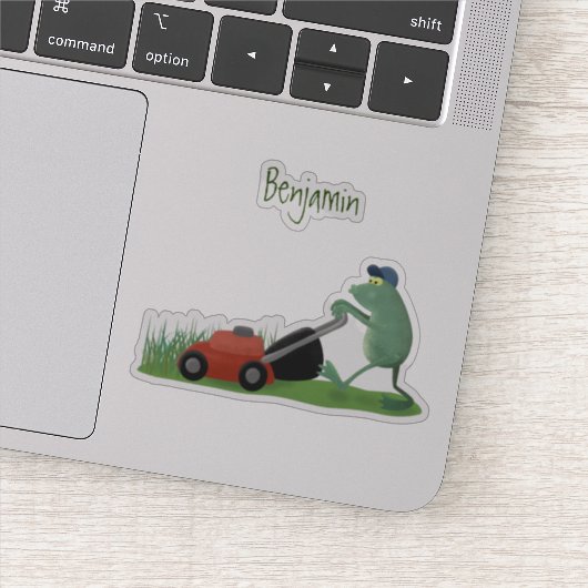 Funny green frog mowing grawn cartoon sticker (Detail)