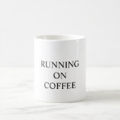 Funny mug states "RUNNING ON COFFEE" (Centre)