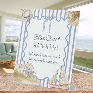 Gastenboek voor strandhuis met blauwe kustchic reclamebord met voetstuk