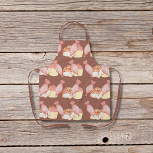 Gebakszakken, kaneelbroodjes en bruine cupcakes schort