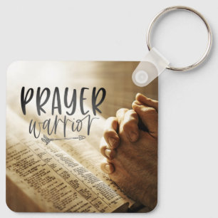 Gebedsstrijder bidt handen op open Bijbel Sleutelhanger