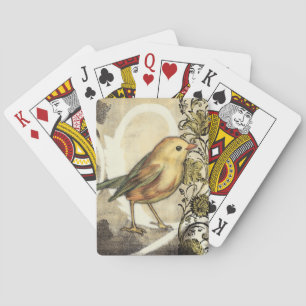 Geel en groen vogel op achtergrond pokerkaarten