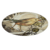 Geel en groen vogel op achtergrond snijplank (Hoek)