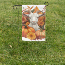 Geit met herfstbloemen en pompoenen