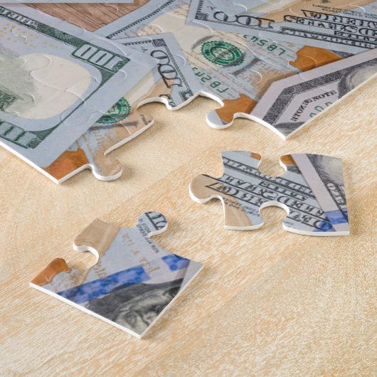 Geldpuzzel met 100 dollar per dollar legpuzzel (Zijkant)