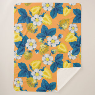 Gele aardbeien op sinaasappel sherpa deken