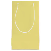 Gele achtergrond van pasteelmaïs, klaar om aan te klein cadeauzakje (Voorkant)