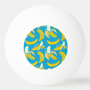 Gele bananen, blauw achtergrondpatroon pingpongballen
