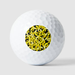 gele bananen: zwarte achtergrond golfballen