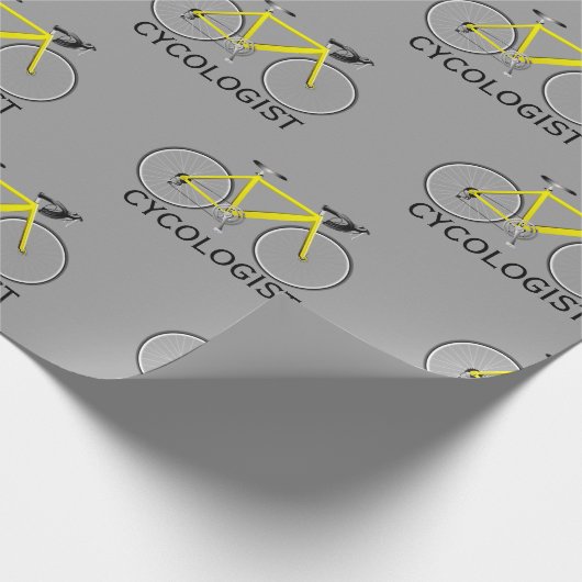 Gele fiets met cycoloog tekst op grijs cadeaupapier (Hoek)