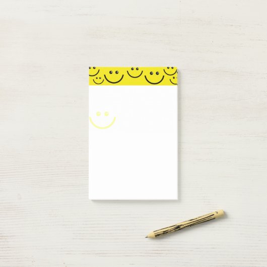 Gele gezichten post-it® notes (Op bureau)