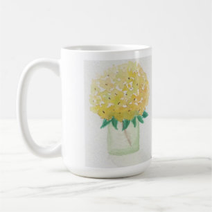 Gele hortensia's in een vaas koffiemok