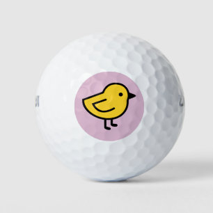 Gele kuiken vogel op een roze achtergrond golfballen
