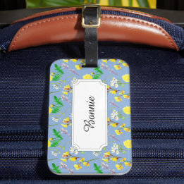 Gele veld bloemen op blauw bagagelabel