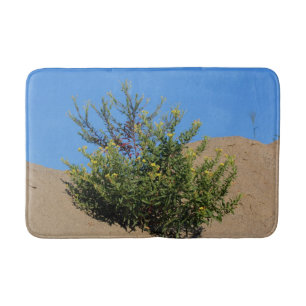 Gele wilde bloemen in zandbloemen badmat