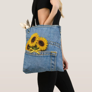 Gele zonnebloemen in blauwe jeanszak draagtas