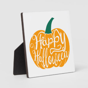 Gelukkige Halloween-belettering op gesneden pompoe Fotoplaat