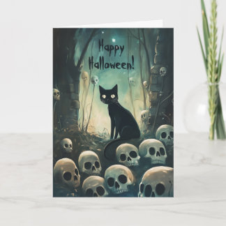 Gelukkige Halloween kat tussen schedels Bedankkaart