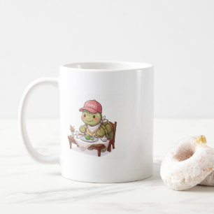 Gelukkige schattige schildpad die een maaltijd nut koffiemok