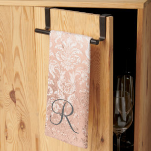 Gemonogrammeerde roze gouden damast theedoek