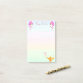 Genieën en magische lamp op pastelkleuren post-it® notes (Op bureau)