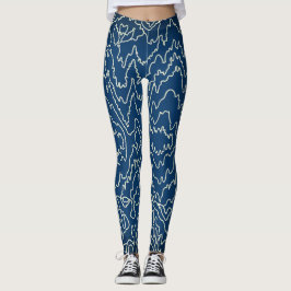 Geometrische witte bochtige lijnen op blauw leggings