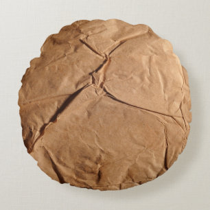 Gerecycleerd verpakkingspapier. Textuur. Rond Kussen