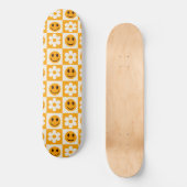Geruite bloemen en lachende gezichten Sinaasappel Skateboard (Voorkant)