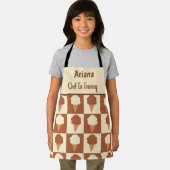 Geruite ijskok in opleiding schort (Insitu)