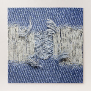 Gescheurd blauw denim: jeans textuur. legpuzzel