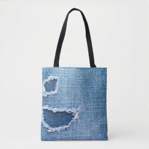 Gescheurde denim stof textuur, blauwe tinten. draagtas