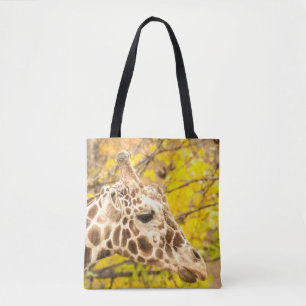 Giraffe en bladeren tote bag