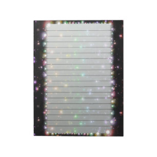 Glanzende regenboogstralen in de ruimte notitieblok