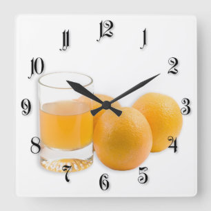 Glas van het sap en de drie sinaasappels vierkante klok