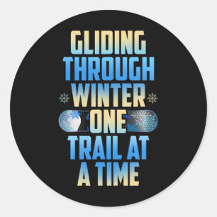 Glijden door de winter een spoor per keer ronde sticker