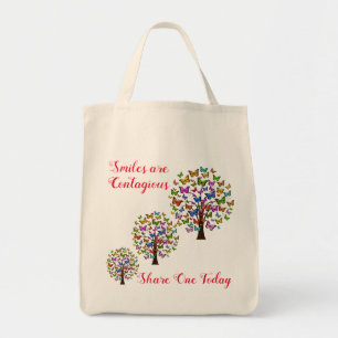 Glimlachen is besmettelijk tote bag