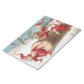 Gnomes dragging a cut tree trunk through the snow notitieblok (Schuin)