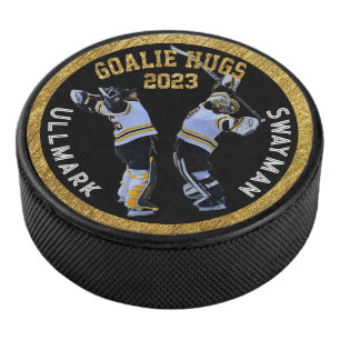 Goalie Hugs Hockey Puck