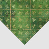 Gold kerstsnowflakes op groen tissuepapier (Detail)