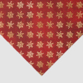 Gold kerstsnowflakes op rood tissuepapier (Detail)